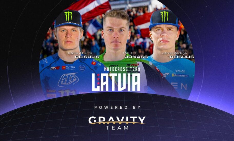Three motocross riders in blue gear—Kaspars Reisulis, Pauls Jonass, and Janis Martins Reisulis—are shown above “Motocross Team Latvia” and “Powered by Gravity Team,” with a nod to token2049 in the design.